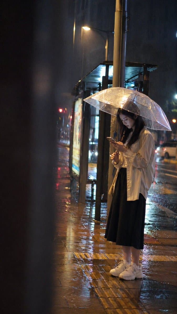 Cinematic rainy night bus stop prompt preview image 1